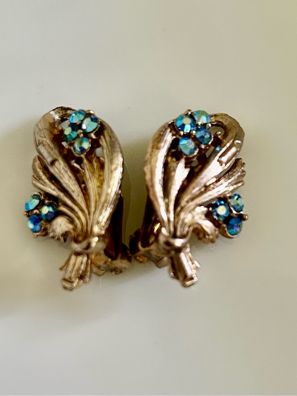 Vintage Gold Tone Floral Clip Earrings with Blue Aurora Borealis Stones